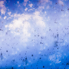  Texture from chaotic drops. Blue shades on a light background.