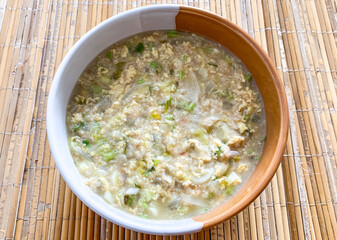 bowl of oatmeal porridge with vegetable.