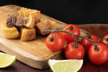 Portion of pancetta, pork belly food, on cutting board.