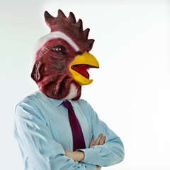 Businessman with head of cock on white background