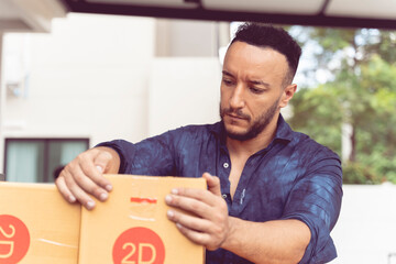 Caucasian delivery man using a forklift to deliver parcels in boxes. Delivery concept.