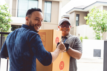 Transport workers are delivering large parcels in boxes to customers at home. Transportation...