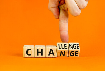 Chance or challenge symbol. Businessman turns wooden cubes and changes the concept word challenge to chance. Beautiful orange table orange background. Business challenge or chance concept. Copy space.