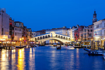 Fototapeta na wymiar Venice Rialto bridge over Canal Grande with gondola travel traveling holidays vacation town in Italy