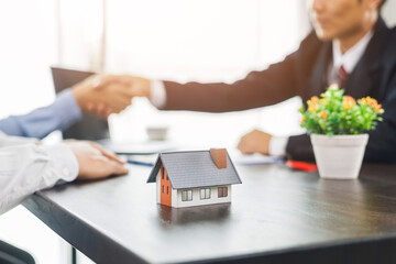 Real estate brokers or real estate agent with client or architect team Discussions about contracts , Saving money to invest in house or property in the future. Business property Concept.