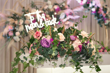 Fototapeta na wymiar Floral decorations for holidays and wedding dinner