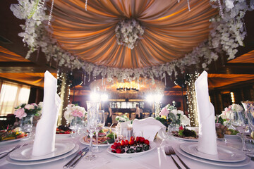 Served wedding banquet table with dishes in the restaurant