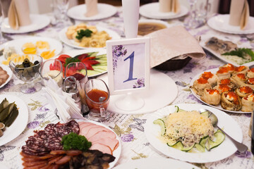 Served wedding banquet table with dishes in the restaurant