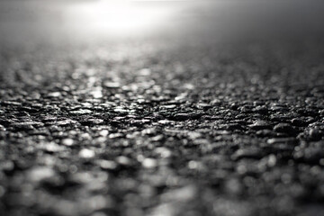 black asphalt road closeup tarmac view blurred background. Selective focus..