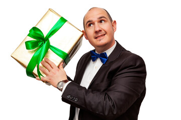Well-dressed man holding a gift