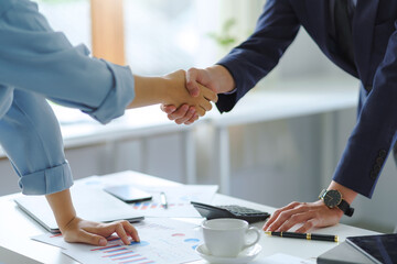 Business success. Businessman shaking hands agreement confirmed in the investment business.
