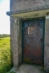 A rusted door an old watchtower