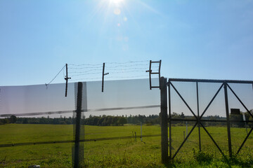 Fototapeta premium Old barbed wire fence on a former GDR border fortification