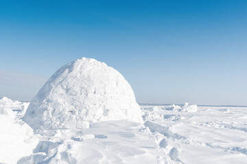Real snow igloo house in the winter.	