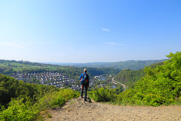 A man is looking to the village Lahnstein, the Lahn and in the background the Lahneck Castle and the All Saints' mountains chapel (Allerheiligenbergkapelle), Germany