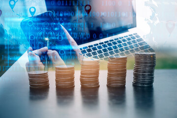 Money (coins), calculator and some stationery on wood table, top view with copy space - financial background concept