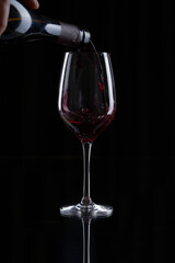 red wine pouring into glass