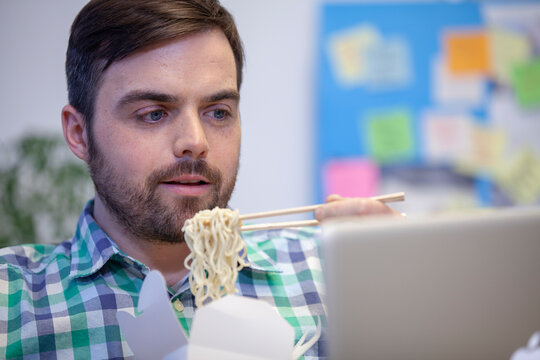 Bearded Man With Take Away Food In Office