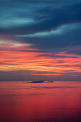 Mystical lighting. Colorful sunset in the evening sky. Great dramatic view. Amazing sky panorama. Meditative calmness and greatness. Clouds illuminated by the setting sun