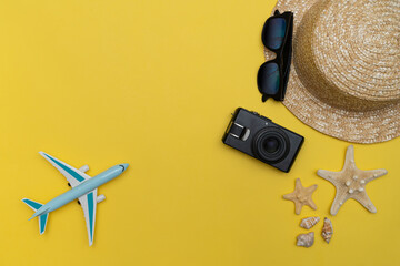 Summer Travel concept. Summer holiday background, Straw hat, sunglasses and sea stars with camera...