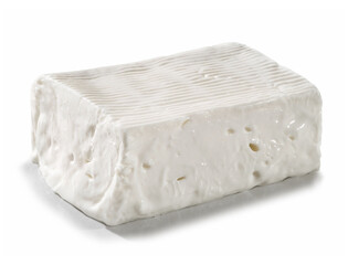 large portion of soft and spreadable fresh cheese, placed on a white surface

