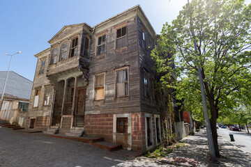 It is an old building with a historical structure in Turkey and its door is made of wood.