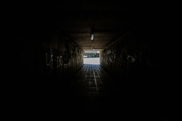 unlit underground passage. a dark tunnel