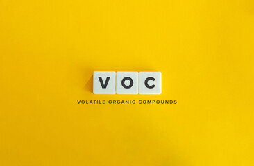 Volatile organic compounds (VOC) Banner. Letter Tiles on Yellow Background. Minimal Aesthetics. - obrazy, fototapety, plakaty