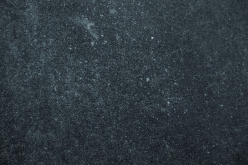 Obraz premium Dark worn blue and black stained surface background or texture
