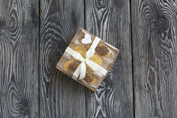 Homemade eclairs with cream. They lie on a plate. Custard pastries with cream. In a gift box. Close-up.