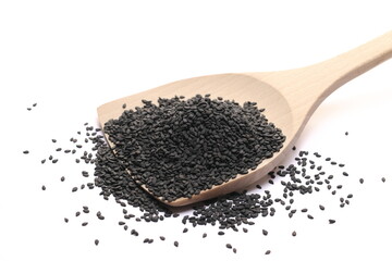 Black sesame seeds pile in wooden spoon isolated on white  