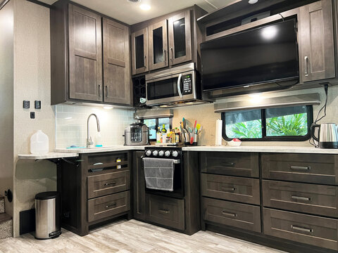 Interior of a modern kitchen in a luxury fifth wheel trailer caravan.