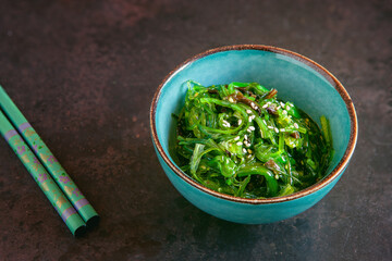 Sea kelp in the bowl with chopsticks