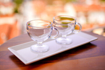 Preparing for breakfast. Table setting. Two empty dessert glasses