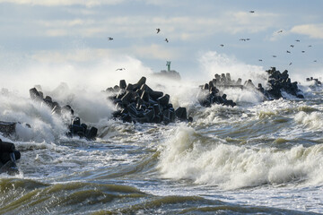 Waves crash on a breakwater during winter storms