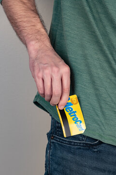 Adult Male Holding A NYC MetroCard With A Shallow Depth Of Field And Copy Space