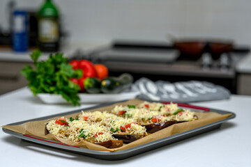 Stuffed eggplants in the making. The ingredients for a healthy dinner are being prepared.