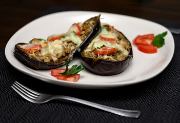 Stuffed eggplants on a plate served in a nice restaurant