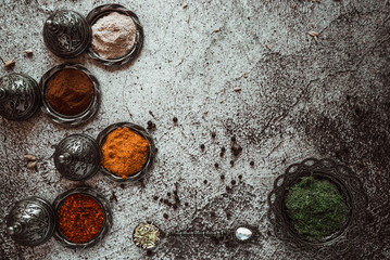 Obraz na płótnie Canvas bright fragrant oriental spices, turmeric, curry, paprika, chili, black pepper, cloves, garlic 1