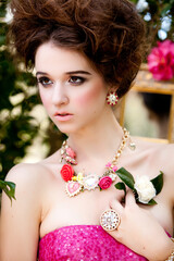 Beauty Model with Jewelry in Whimsical Alice in Wonderland Fashion Shoot Outdoors in Shabby Chic Garden