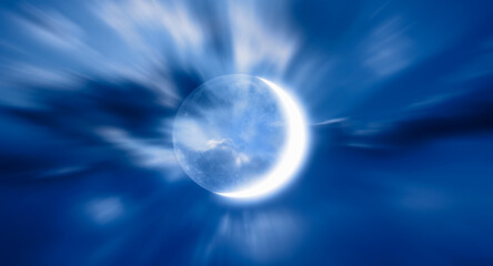 Night sky with crescent bright moon in the clouds 