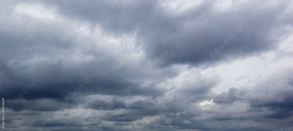 Aufkleber The dark sky with heavy clouds converging and a violent storm before the rain.Bad weather sky..