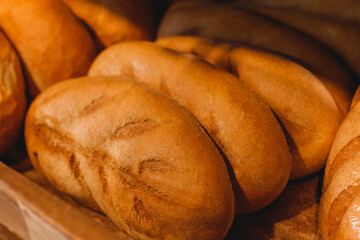 Handmade artisan bread loaves on the counter top of bakery to entice customers to buy