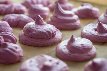 Pink meringue.Homemade pastries. Sweets made of pink cream.Meringue for weight loss.