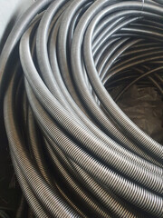 Manufacture of stainless steel braid. Flexible metal pipes with a braid.