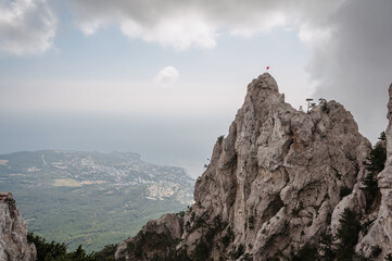 Naklejka na ściany i meble The top of Ai-Petri Mountain in Crimea rises above the sea in Yalta