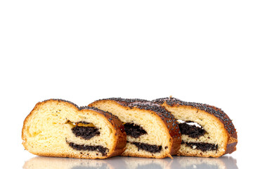 Three slices of fragrant homemade poppy seed roll, macro, isolated on a white background.