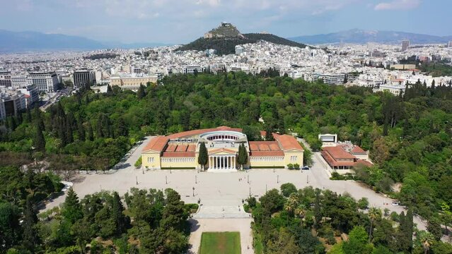 Aerial drone video of iconic public Zappio hall used for events and whole Athens cityscape at the background, Attica, Greece
