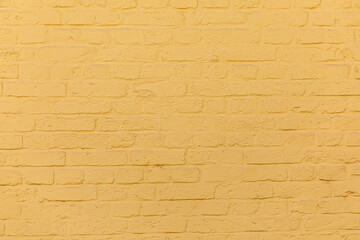Obraz premium pattern of harmonic painted yellow brick wall