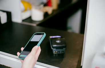 person using smartphone to pay